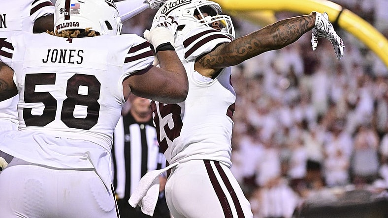 Sep 9, 2023; Starkville, Mississippi, USA; Mississippi State Bulldogs running back Jeffery Pittman (25) reacts teammates after a touchdown against the Arizona Wildcats during overtime at Davis Wade Stadium at Scott Field. Mandatory Credit: Matt Bush-USA TODAY Sports