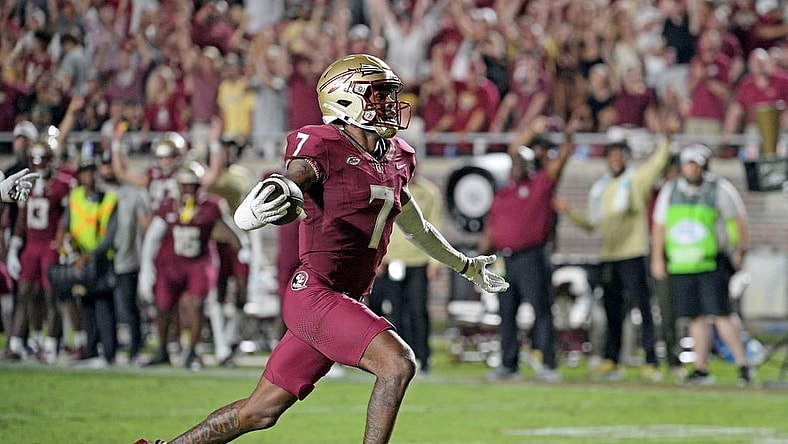 Sep 9, 2023; Tallahassee, Florida, USA; Florida State Seminoles defensive back Jarrian Jones (7) intercepts a pass and takes it for a touchdown during the game against the Southern Miss Golden Eagles at Doak S. Campbell Stadium. Mandatory Credit: Melina Myers-USA TODAY Sports