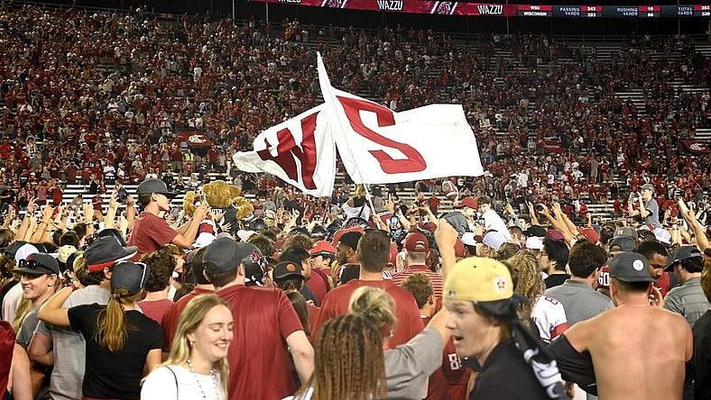 Sep 9, 2023; Pullman, Washington, USA; Washington State Cougars fans rush there field after a game against the Wisconsin Badgers at Gesa Field at Martin Stadium. Washington State won 31-22. Mandatory Credit: James Snook-USA TODAY Sports