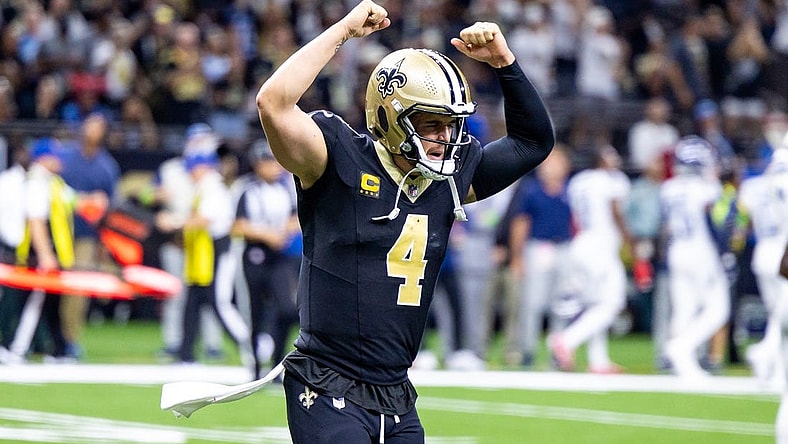 Sep 10, 2023; New Orleans, Louisiana, USA;  New Orleans Saints quarterback Derek Carr (4) celebrate a touchdown pass to New Orleans Saints wide receiver Rashid Shaheed (22) against the Tennessee Titans during the second half at the Caesars Superdome. Mandatory Credit: Stephen Lew-USA TODAY Sports