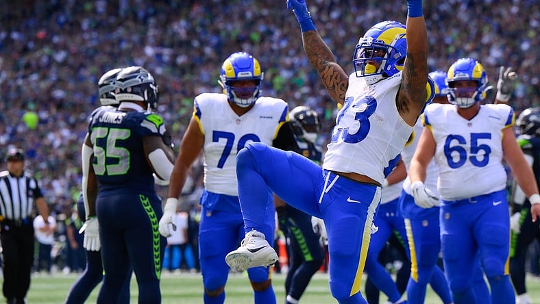 Sep 10, 2023; Seattle, Washington, USA; Los Angeles Rams running back Kyren Williams (23) celebrates scoring a touchdown against the Seattle Seahawks during the first half at Lumen Field. Mandatory Credit: Steven Bisig-USA TODAY Sports