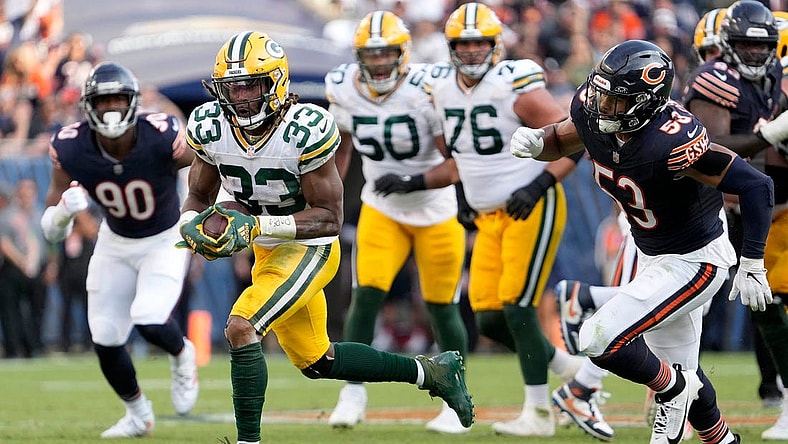 Green Bay Packers running back Aaron Jones (33) runs for a touchdown during second half of their game against the Chicago Bears on Sunday, Sept. 10, 2023 at Soldier Field in Chicago.