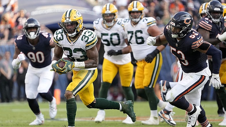 Sep 10, 2023; Chicago, Illinois, USA; Green Bay Packers running back Aaron Jones (33) runs for a touchdown during the second half of their game against the Chicago Bears at Soldier Field. Mandatory Credit: Mike De Sisti-USA TODAY Sports