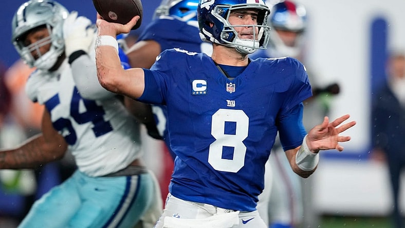 New York Giants quarterback Daniel Jones (8) throws a pass as he receives help from his offensive line. Sunday, September 10, 2023