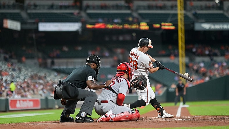 Sep 11, 2023; Baltimore, Maryland, USA;  Baltimore Orioles third baseman Ramon Urias (29) hits a second inning rbi single against the St. Louis Cardinals at Oriole Park at Camden Yards. Mandatory Credit: Tommy Gilligan-USA TODAY Sports