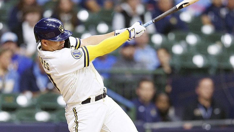 Sep 11, 2023; Milwaukee, Wisconsin, USA; Milwaukee Brewers shortstop Willy Adames (27) hits an RBI double during the third inning against the Miami Marlins at American Family Field. Mandatory Credit: Jeff Hanisch-USA TODAY Sports