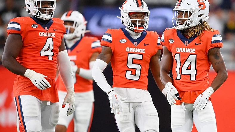 Sep 9, 2023; Syracuse, New York, USA; Syracuse Orange defensive lineman Caleb Okechukwu (4) and defensive back Alijah Clark (5) and defensive back Jason Simmons Jr. (14) reacts to a play against the Western Michigan Broncos during the second half at the JMA Wireless Dome. Mandatory Credit: Rich Barnes-USA TODAY Sports