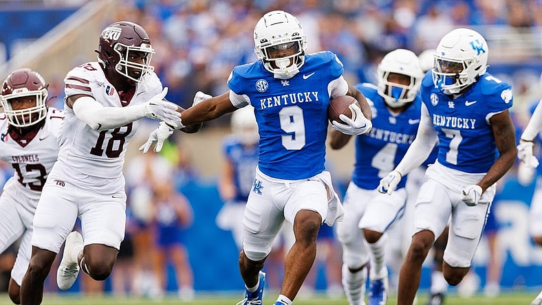 Sep 9, 2023; Lexington, Kentucky, USA; Kentucky Wildcats wide receiver Tayvion Robinson (9) runs down the field against Eastern Kentucky Colonels linebacker Cornelius Evans (18) during the third quarter at Kroger Field. Mandatory Credit: Jordan Prather-USA TODAY Sports