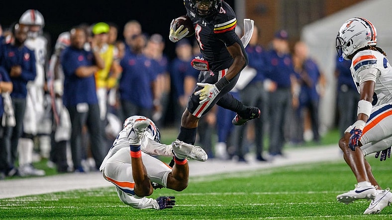 Sep 15, 2023; College Park, Maryland, USA; Maryland Terrapins wide receiver Shaleak Knotts (4) is tackled during the second quarter against the Virginia Cavaliers at SECU Stadium. Mandatory Credit: Reggie Hildred-USA TODAY Sports