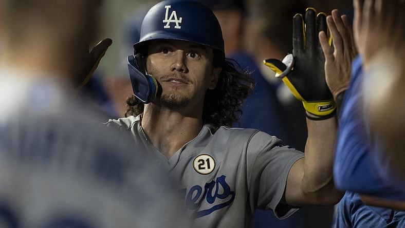 Sep 15, 2023; Seattle, Washington, USA; Los Angeles Dodgers centerfielder James Outman (33) is congratulated by teammates in the dugout after hitting a solo home run during the ninth inning against the Seattle Mariners at T-Mobile Park. Mandatory Credit: Stephen Brashear-USA TODAY Sports