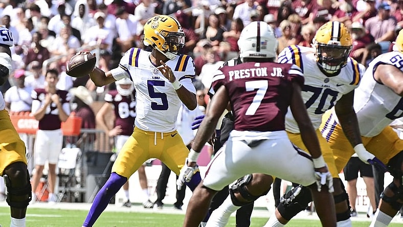 Sep 16, 2023; Starkville, Mississippi, USA; LSU Tigers quarterback Jayden Daniels (5) makes a pass against the Mississippi State Bulldogs during the first quarter at Davis Wade Stadium at Scott Field. Mandatory Credit: Matt Bush-USA TODAY Sports