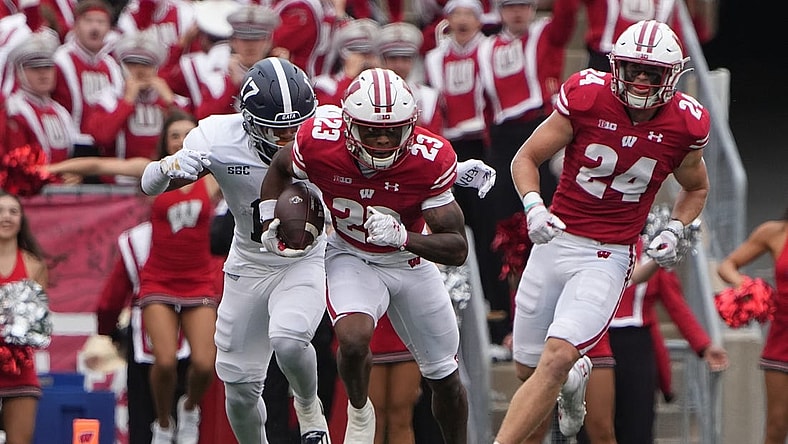 Sep 16, 2023; Madison, Wisconsin, USA; Wisconsin Badgers cornerback Jason Maitre (23) returns an interception against Georgia Southern Eagles during the second quarter at Camp Randall Stadium. Mandatory Credit: Mark Hoffman-USA TODAY Sports