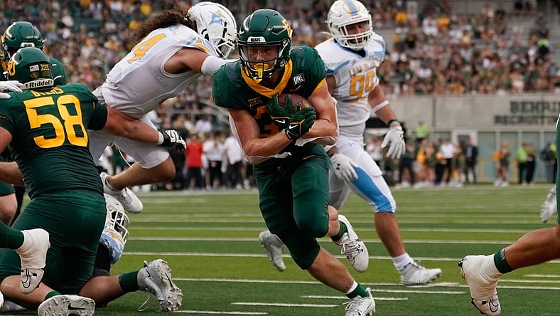 Sep 16, 2023; Waco, Texas, USA;  Baylor Bears running back Dawson Pendergrass (35) scores on a touchdown run against the Long Island Sharks during the first half at McLane Stadium. Mandatory Credit: Chris Jones-USA TODAY Sports