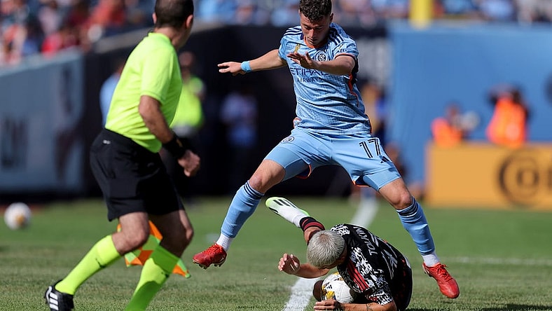 Sep 16, 2023; New York, New York, USA; New York Red Bulls defender John Tolkin (47) and New York City FC midfielder Matias Pellegrini (17) fight for the ball during the first half at Yankee Stadium. Mandatory Credit: Brad Penner-USA TODAY Sports