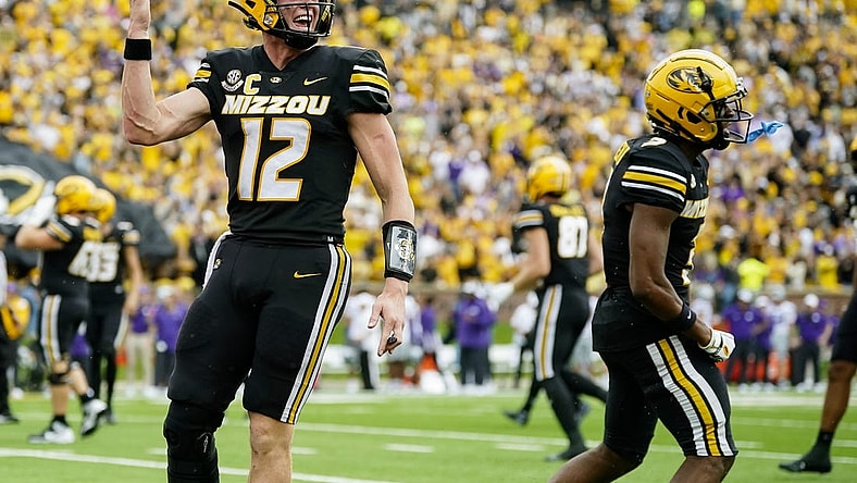 Sep 16, 2023; Columbia, Missouri, USA; Missouri Tigers quarterback Brady Cook (12) and wide receiver Luther Burden III (3) celebrate after a touchdown during the second half against the Kansas State Wildcats at Faurot Field at Memorial Stadium. Mandatory Credit: Jay Biggerstaff-USA TODAY Sports