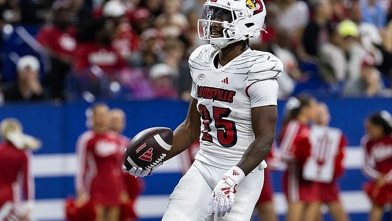 Sep 16, 2023; Indianapolis, Indiana, USA; Louisville Cardinals running back Jawhar Jordan (25) celebrates after scoring a touchdown against the Indiana Hoosiers in the second quarter at Lucas Oil Stadium. Mandatory Credit: Trevor Ruszkowski-USA TODAY Sports