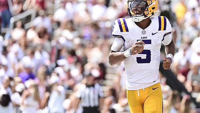 Sep 16, 2023; Starkville, Mississippi, USA; LSU Tigers quarterback Jayden Daniels (5) reacts after a play against the Mississippi State Bulldogs during the second half at Davis Wade Stadium at Scott Field. Mandatory Credit: Matt Bush-USA TODAY Sports