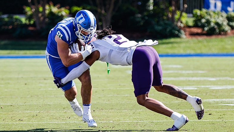 Sep 16, 2023; Durham, North Carolina, USA;  Northwestern Wildcats defensive back Garnett Hollis Jr. (2) tackles Duke Blue Devils running back Grissim Anderson (41) during the first half against Duke Blue Devils at Wallace Wade Stadium. Mandatory Credit: Jaylynn Nash-USA TODAY Sports