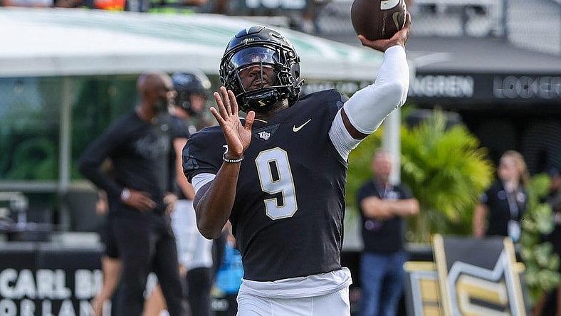 Sep 16, 2023; Orlando, Florida, USA; UCF Knights quarterback Timmy McClain (9) warms up before the game against the Villanova Wildcats at FBC Mortgage Stadium. Mandatory Credit: Mike Watters-USA TODAY Sports