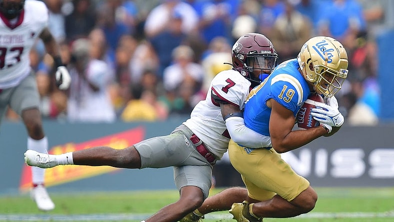 Sep 16, 2023; Pasadena, California, USA; UCLA Bruins wide receiver Kyle Ford (19) is brought down by North Carolina Central Eagles defensive back JaJuan Hudson (7) during the first half at Rose Bowl. Mandatory Credit: Gary A. Vasquez-USA TODAY Sports