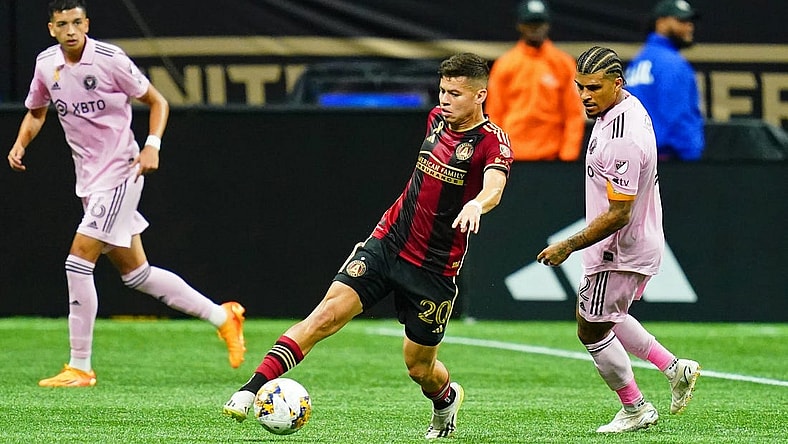 Sep 16, 2023; Atlanta, Georgia, USA; Atlanta United midfielder Matheus Rossetto (20) dribbles the ball against Inter Miami CF defender DeAndre Yedlin (2) during the first half at Mercedes-Benz Stadium. Mandatory Credit: John David Mercer-USA TODAY Sports