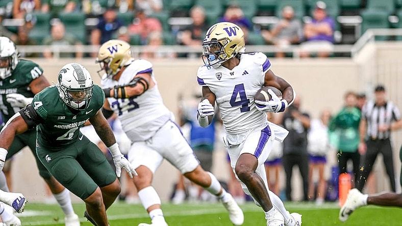 Washington's Germie Bernard, right, runs for a touchdown against Michigan State during the first quarter on Saturday, Sept. 16, 2023, at Spartan Stadium in East Lansing.
