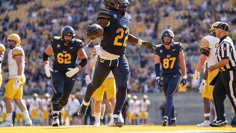 September 16, 2023; Berkeley, California, USA; California Golden Bears running back Isaiah Ifanse (22) scores a touchdown against the Idaho Vandals during the third quarter at California Memorial Stadium. Mandatory Credit: Kyle Terada-USA TODAY Sports