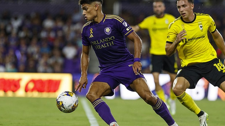 Sep 16, 2023; Orlando, Florida, USA; Orlando City SC forward Ramiro Enrique (7) controls the ball against Columbus Crew defender Malte Amundsen (18) in the first half at Exploria Stadium. Mandatory Credit: Morgan Tencza-USA TODAY Sports