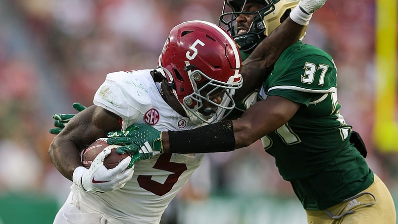 Sep 16, 2023; Tampa, Florida, USA;  Alabama Crimson Tide running back Roydell Williams (5) is tackled by South Florida Bulls safety Logan Berryhill (37) in the third quarter at Raymond James Stadium. Mandatory Credit: Nathan Ray Seebeck-USA TODAY Sports