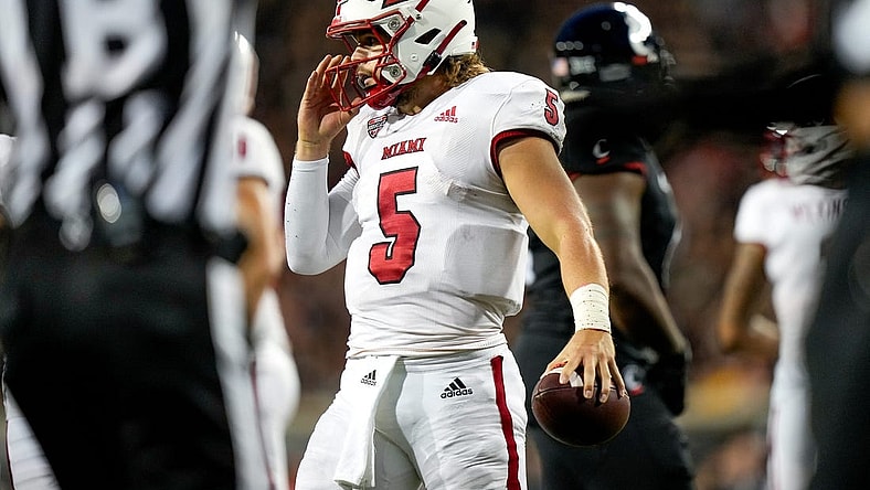 Miami (Oh) RedHawks quarterback Brett Gabbert (5) holds the ball between plays during the NCAA football game between the Cincinnati Bearcats and the Miami RedHawks at Nippert Stadium in Cincinnati on Saturday, Sept. 16, 2023.