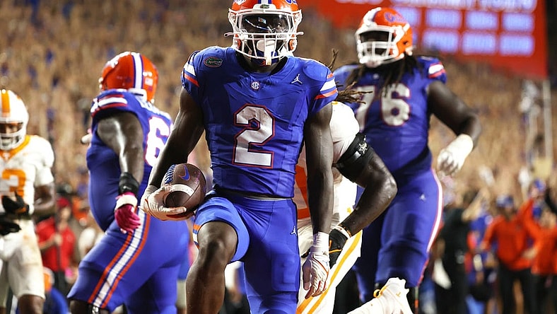 Sep 16, 2023; Gainesville, Florida, USA; Florida Gators running back Montrell Johnson Jr. (2) runs the ball in for a touchdown against the Tennessee Volunteers  during the second quarter at Ben Hill Griffin Stadium. Mandatory Credit: Kim Klement Neitzel-USA TODAY Sports