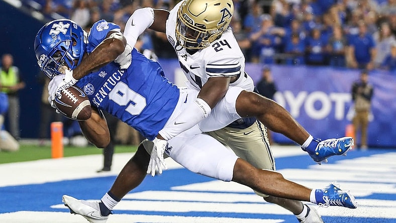 Kentucky Wildcats wide receiver Tayvion Robinson (9) makes a late second quarter touchdown catch over Akron Zips cornerback Darrian Lewis (24) to put the Cats up by two touchdowns in the first half in Saturday's game at Kroger Field in Lexington. Sept. 16, 2023
