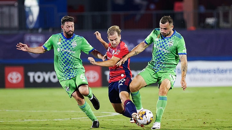 Sep 16, 2023; Frisco, Texas, USA;  Seattle Sounders midfielder Joao Paulo (6) and Seattle Sounders forward Jordan Morris (13) battle for the ball with FC Dallas midfielder Paxton Pomykal (19) during the first half at Toyota Stadium. Mandatory Credit: Kevin Jairaj-USA TODAY Sports