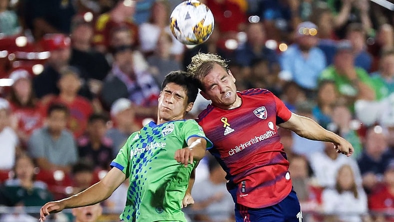 Sep 16, 2023; Frisco, Texas, USA;  Seattle Sounders forward Jordan Morris (13) and FC Dallas midfielder Paxton Pomykal (19) go for the ball during the first half at Toyota Stadium. Mandatory Credit: Kevin Jairaj-USA TODAY Sports