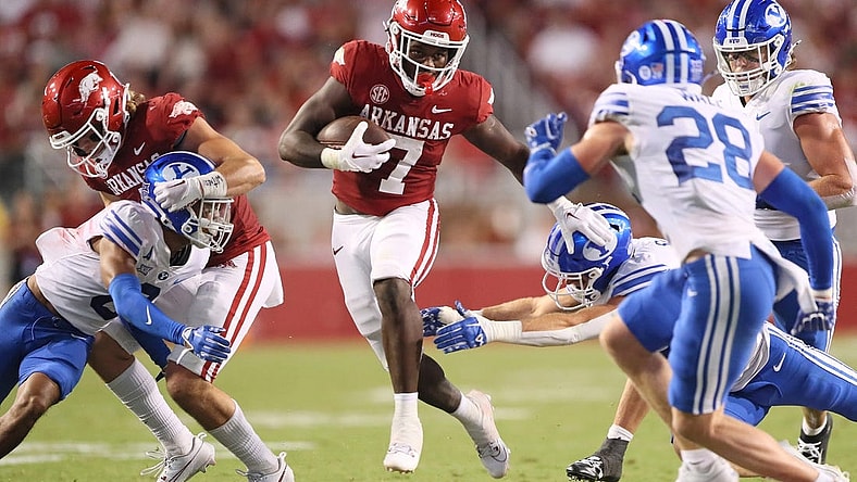 Sep 16, 2023; Fayetteville, Arkansas, USA; Arkansas Razorbacks running back Rashod Dubinion (7) rushes in the second quarter against the BYU Cougars at Donald W. Reynolds Razorback Stadium. Mandatory Credit: Nelson Chenault-USA TODAY Sports