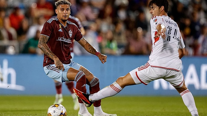 Sep 16, 2023; Commerce City, Colorado, USA; Colorado Rapids forward Rafael Navarro (9) passes the ball as New England Revolution midfielder Ian Harkes (14) defends in the first half at Dick's Sporting Goods Park. Mandatory Credit: Isaiah J. Downing-USA TODAY Sports