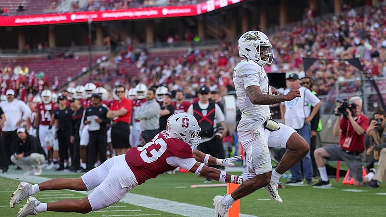 Sep 16, 2023; Stanford, California, USA; Sacramento State Hornets quarterback Kaiden Bennett (1) runs for a touchdown past Stanford Cardinal safety Alaka'i Gilman (33) during the second quarter at Stanford Stadium. Mandatory Credit: Sergio Estrada-USA TODAY Sports