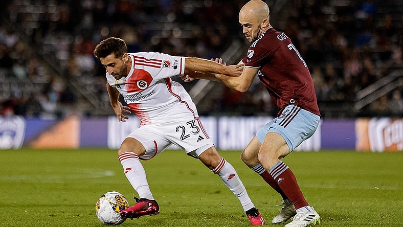 Sep 16, 2023; Commerce City, Colorado, USA; New England Revolution midfielder Nacho Gil (23) and Colorado Rapids defender Andrew Gutman (13) battle for the ball in the first half at Dick's Sporting Goods Park. Mandatory Credit: Isaiah J. Downing-USA TODAY Sports