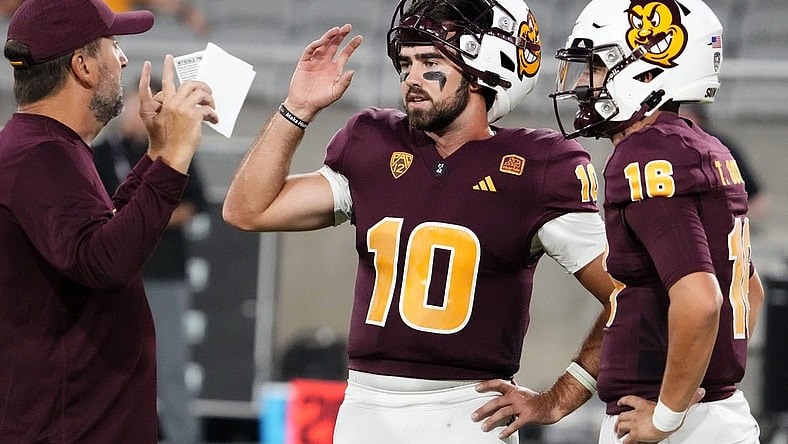 Arizona State Sun Devils offensive coordinator Beau Baldwin talks to his quarterbacks Drew Pyne (10) and Trenton Bourguet (16) during pregame warms-up before playing the Fresno State Bulldogs at Mountain America Stadium in Tempe on Sept. 16, 2023.