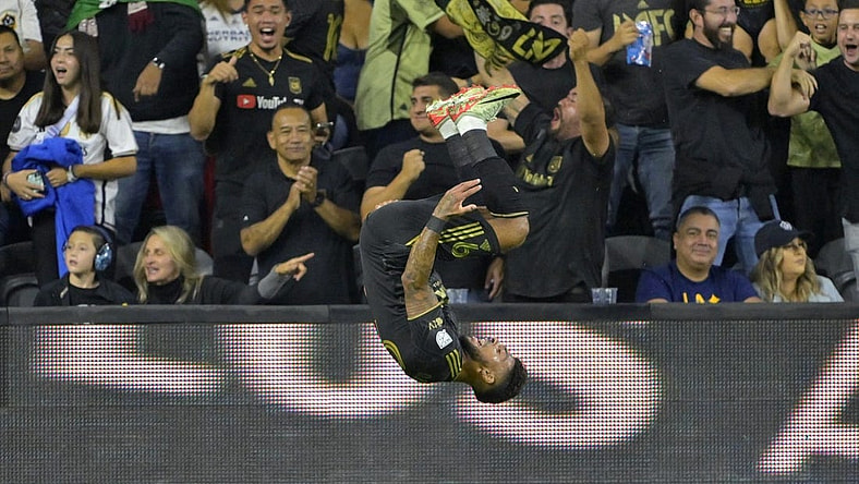 Sep 16, 2023; Los Angeles, California, USA; Los Angeles FC forward Denis Bouanga (99) celebrates after scoring a goal past Los Angeles Galaxy goalkeeper Jonathan Bond (1) off a pass by Los Angeles Galaxy forward Michael Barrios (12) in the first half at BMO Stadium. Mandatory Credit: Jayne Kamin-Oncea-USA TODAY Sports