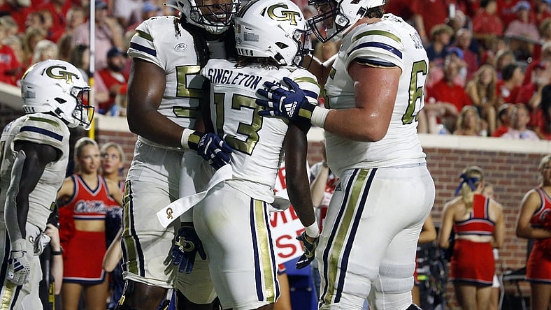 Sep 16, 2023; Oxford, Mississippi, USA; Georgia Tech Yellow Jackets wide receiver Eric Singleton, Jr. (13) reacts with offensive linemen Jordan Williams (54) and Connor Scaglione (65) during the second half against the Mississippi Rebels at Vaught-Hemingway Stadium. Mandatory Credit: Petre Thomas-USA TODAY Sports