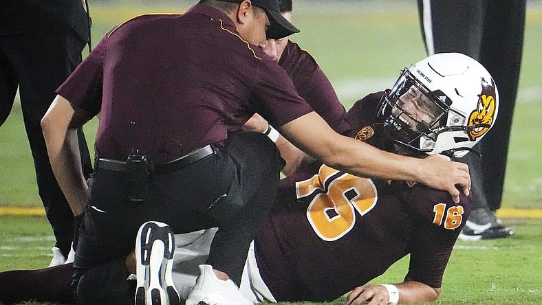 Arizona State Sun Devils quarterback Trenton Bourguet (16) grimaces after an ankle injury that forced him to leave the game against the Fresno State Bulldogs in the first half at Mountain America Stadium in Tempe on Sept. 16, 2023.