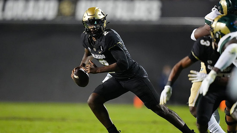 Sep 16, 2023; Boulder, Colorado, USA; Colorado Buffaloes quarterback Shedeur Sanders (2) scrambles in double overtime against the Colorado State Rams at Folsom Field. Mandatory Credit: Ron Chenoy-USA TODAY Sports