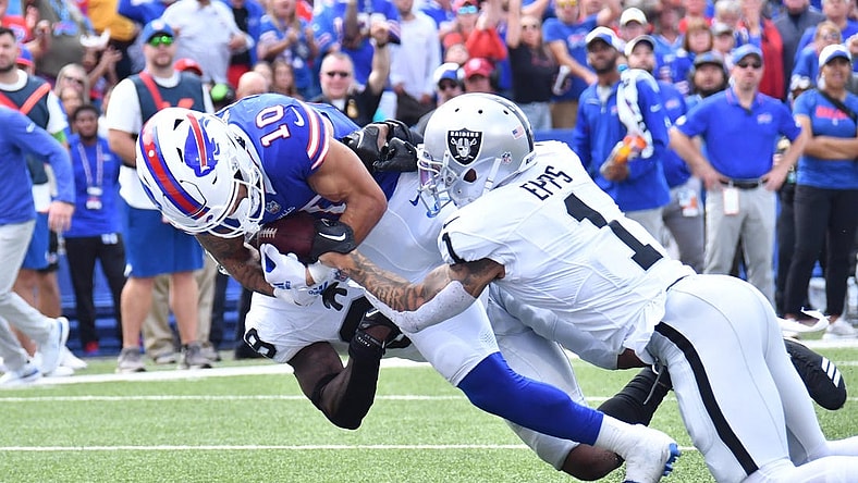 Sep 17, 2023; Orchard Park, New York, USA; Buffalo Bills wide receiver Khalil Shakir (10) scores a touchdown as he is tackled by Las Vegas Raiders safety Marcus Epps (1) in the second quarter at Highmark Stadium. Mandatory Credit: Mark Konezny-USA TODAY Sports
