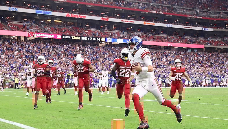 Sep 17, 2023; Glendale, Arizona, USA; New York Giants quarterback Daniel Jones (8) runs for a touchdown against the Arizona Cardinals during the second half at State Farm Stadium. Mandatory Credit: Joe Camporeale-USA TODAY Sports
