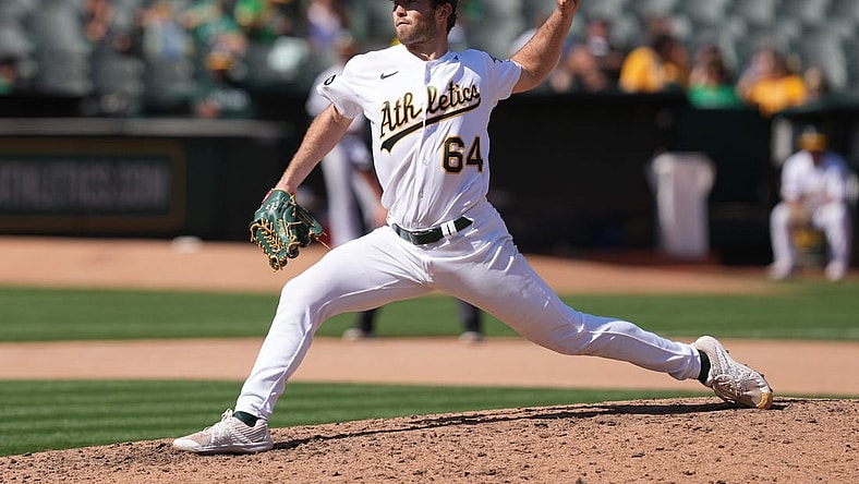Sep 17, 2023; Oakland, California, USA; Oakland Athletics starting pitcher Ken Waldichuk (64) throws a pitch against the San Diego Padres during the seventh inning at Oakland-Alameda County Coliseum. Mandatory Credit: Darren Yamashita-USA TODAY Sports