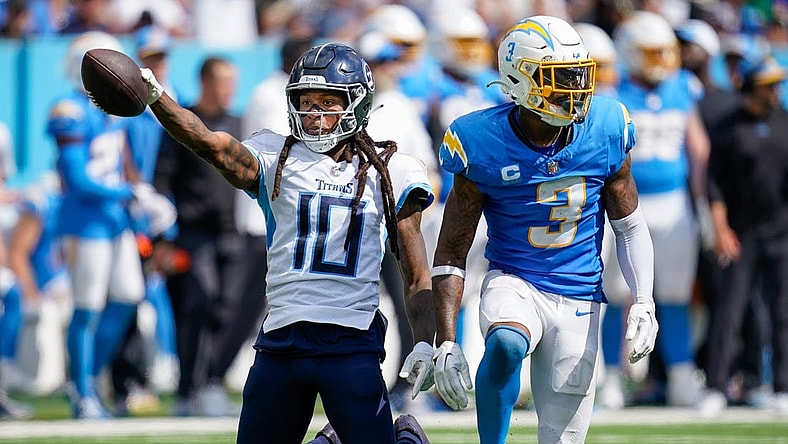 Tennessee Titans wide receiver DeAndre Hopkins (10) celebrates receiving a pass next to Los Angeles Chargers safety Derwin James Jr. (3) during the fourth quarter at Nissan Stadium in Nashville, Tenn., Sunday, Sept. 17, 2023.