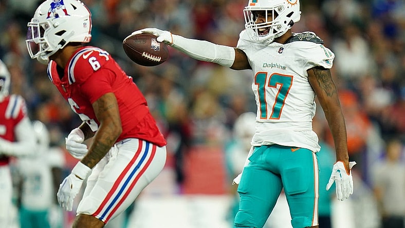 Sep 17, 2023; Foxborough, Massachusetts, USA; Miami Dolphins wide receiver Jaylen Waddle (17) reacts after his first down catch against New England Patriots cornerback Christian Gonzalez (6) in the second quarter at Gillette Stadium. Mandatory Credit: David Butler II-USA TODAY Sports