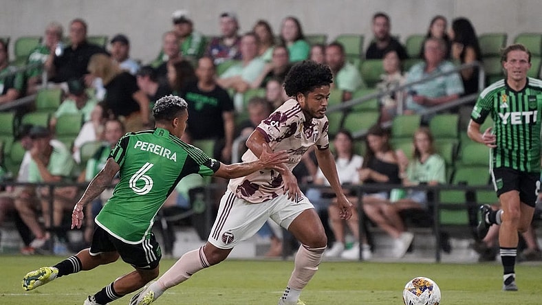 Sep 17, 2023; Austin, Texas, USA; Portland Timbers midfielder Evander (20) dribbles against Austin FC midfielder Daniel Pereira (6) during the second half at Q2 Stadium. Mandatory Credit: Scott Wachter-USA TODAY Sports