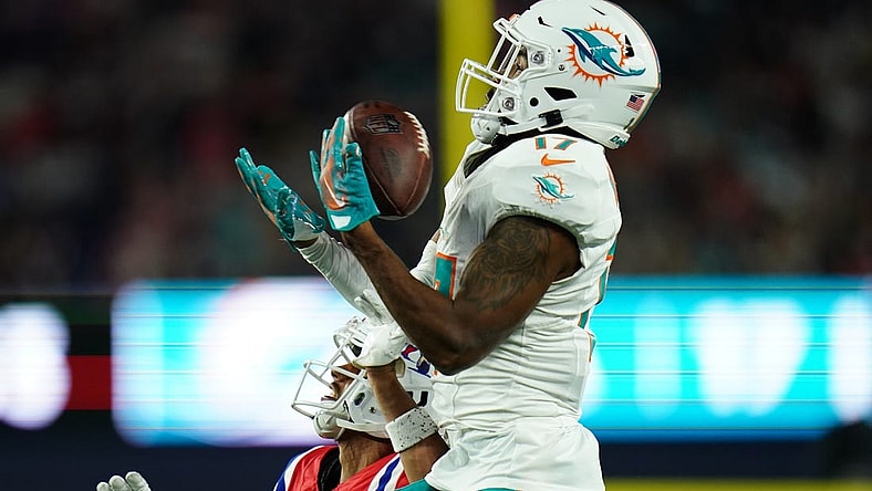 Sep 17, 2023; Foxborough, Massachusetts, USA; Miami Dolphins wide receiver Jaylen Waddle (17) makes the catch against New England Patriots cornerback Myles Bryant (27) in the second half at Gillette Stadium. Mandatory Credit: David Butler II-USA TODAY Sports